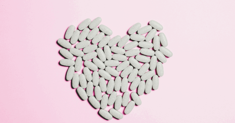 Methamphetamine detection: Pills arranged in a heart shape on pink, representing drug testing and detection times.